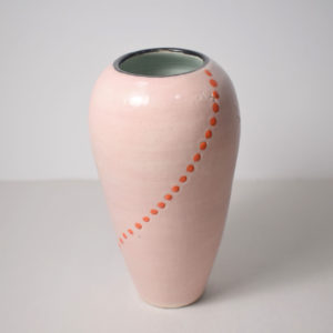 Pink ceramic vase with orange dots