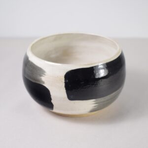 Painted black and white ceramic bowl
