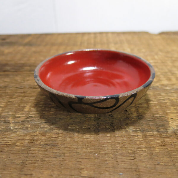 Small ceramic sauce bowl. Glossy glaze inside.