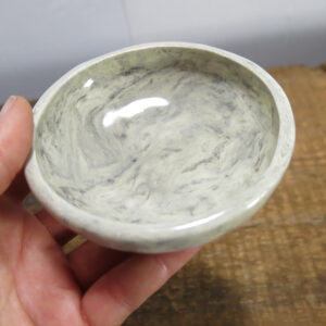 Small porcelain bowl marbled with black underglaze.