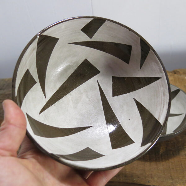 Black clay ceramic cereal bowls, decorated with a triangle white underglaze pattern.