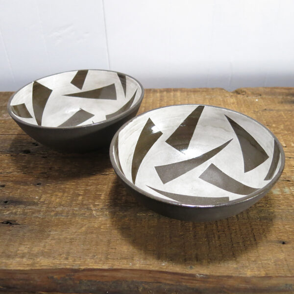 Black clay ceramic cereal bowls, decorated with a triangle white underglaze pattern.