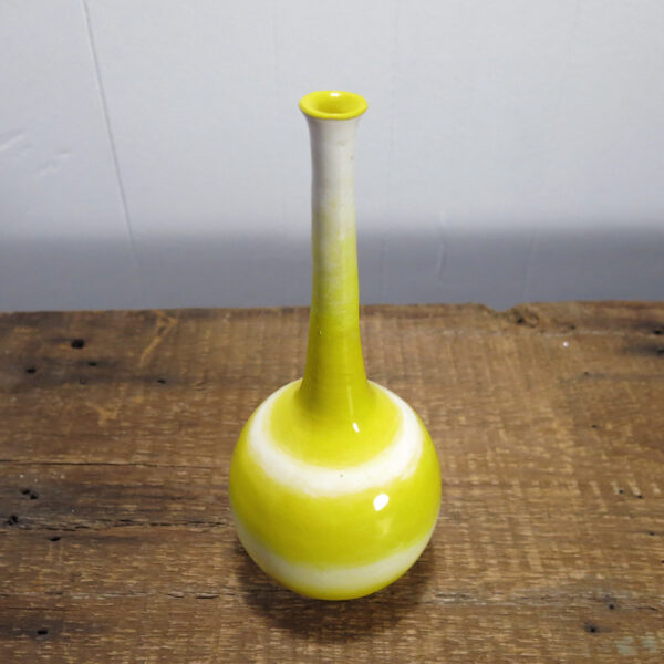 Porcelain vase with a very long, thin neck.
