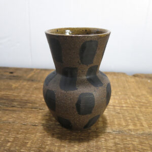 Dark brown clay vase with painted rectangle pattern.