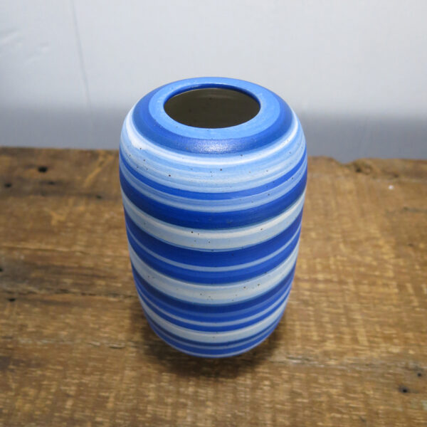 Ceramic vase with blue stripes.
