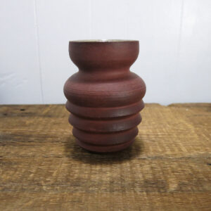 Ceramic purple vase.