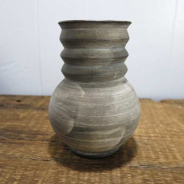 Ceramic vase with brushed texture.