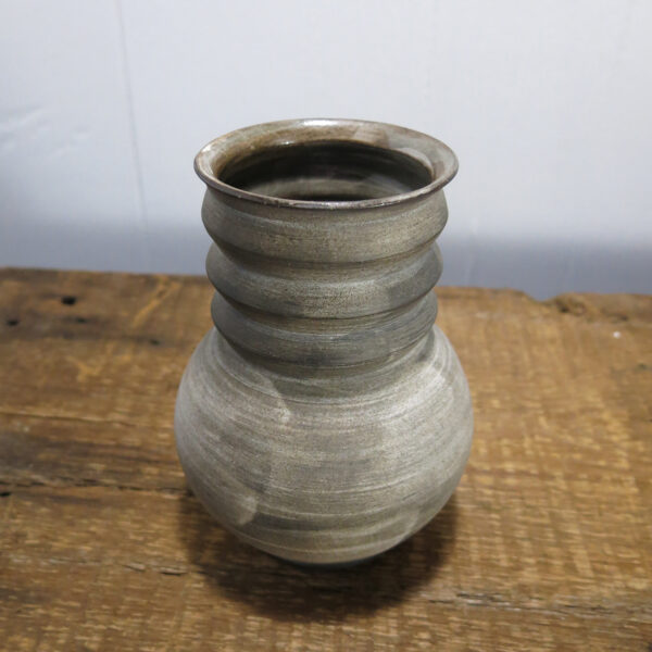 Ceramic vase with white texture brushed.