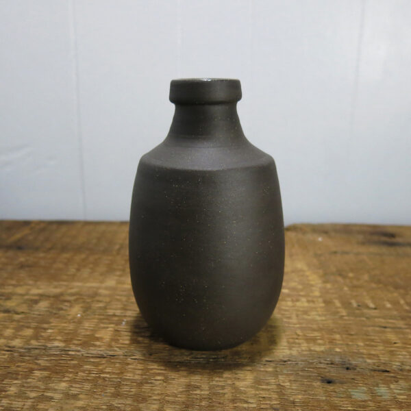 Black clay ceramic bottle, at a different angle.
