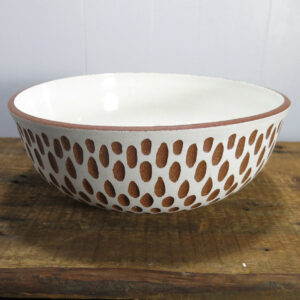 Large white and red/brown carved ceramic bowl.