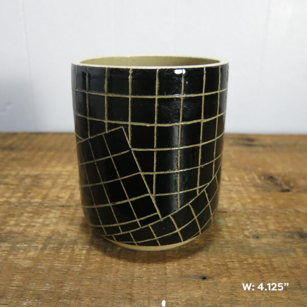 One ceramic cylinder pot with a black and white grid pattern, made of cream-colored clay. This one is labeled as being 4.125 inches wide.