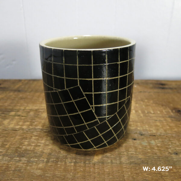 One ceramic cylinder pot with a black and white grid pattern, made of cream-colored clay. This one is labeled as being 4.625 wide.